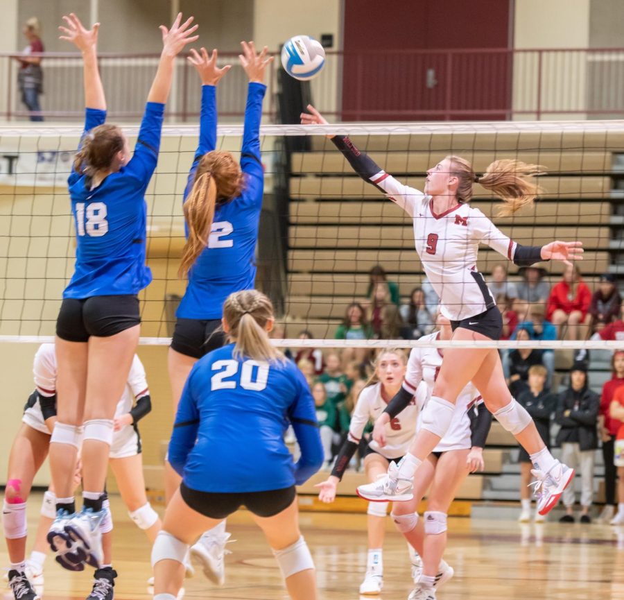 Senior Ashley Murray up at the net at the volleyball game against Lakeland.