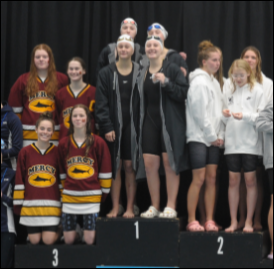 The record-breaking 200 freestyle relay team (top center: Hutchinson, Hebert, Dameworth, Armstrong) is all smiles on the podium after finishing in 9th place (Photo courtesy of Asst. Coach Samantha Snyder). 