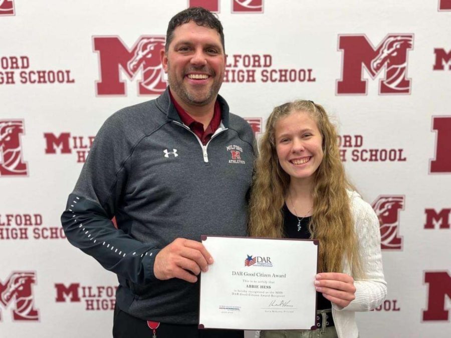 Mr. McKenna awarding Abbie Hess the DAR certificate.