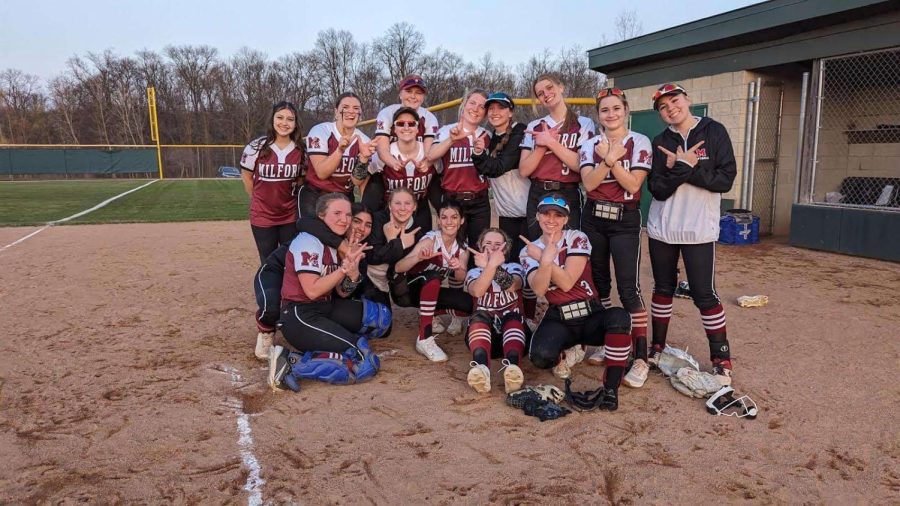 Milford’s softball team celebrating after their 10-9 win against Novi High school 