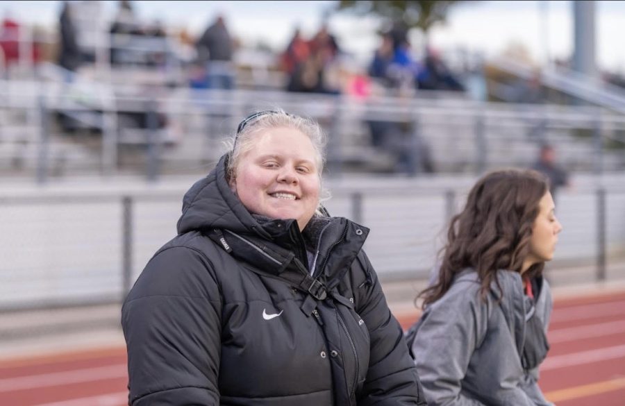 Kira Planck watching the Milford vs. South Lyon East football game 