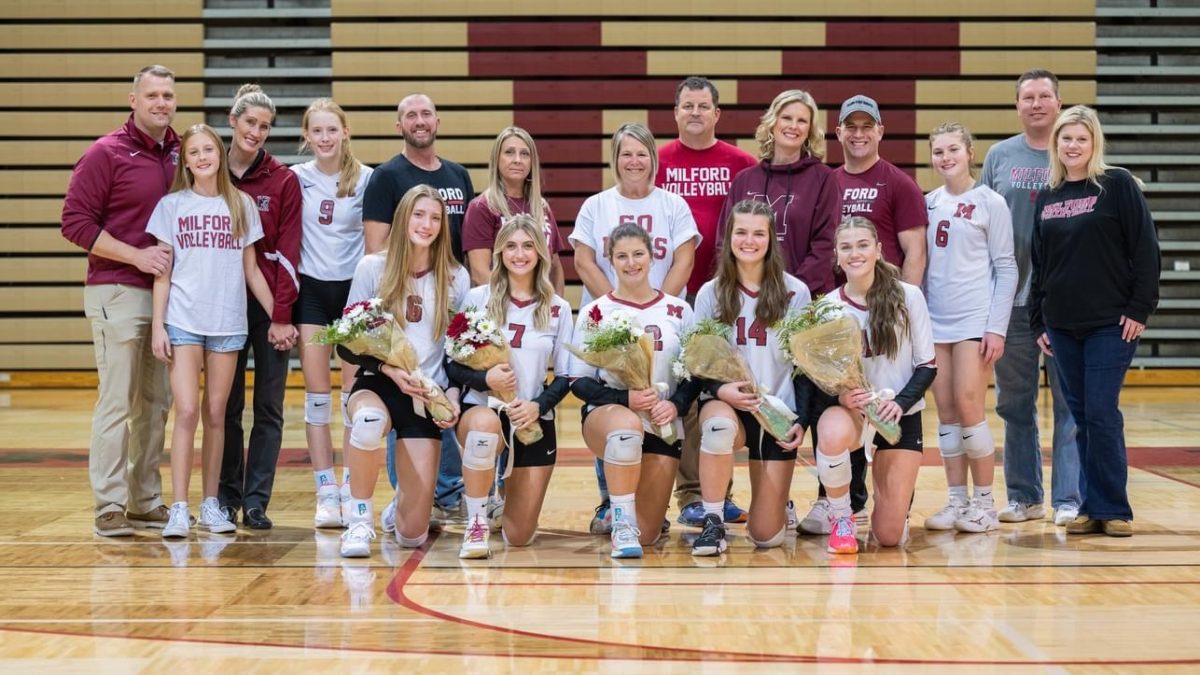 Milfords five volleyball seniors with their families.
