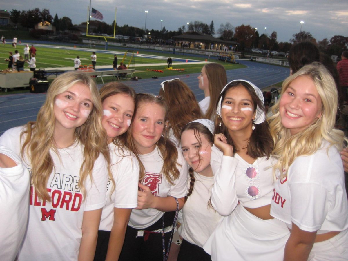 Kate Kelly, Taegen Skatzka, Hana Scripture, Kaitlyn Williamson, Alana Banier, and Olivia Diaz at the playoffs game.